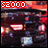 Red banner with white pixelated '52000' text above dark background featuring glowing red and blue elements, light streaks, and a small blue square.