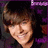 A person with brown hair and bangs smiles in a pixelated image with purple and dark background elements.