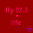 Red background with pink text 'fly 92.3 = life' and two purple pixelated hearts below the text.