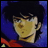 Pixelated anime-style character with dark hair and yellow skin against blue background, next to text reading "Anime IM" and "com" on black background.