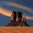 Pixelated static image of a desert butte at sunset with orange sky and blue horizon, rendered in low-resolution 48x48 pixels.
