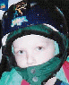 Animated sequence showing a child in a blue helmet with green accents and a white face mask, transitioning to a static image of the same child.