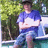 A pixelated image of a person in blue clothing sitting outdoors with text reading 'its me', 'my boat', and 'and I' on a cyan background.