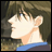 Pixelated anime-style profile of a character with brown hair and a blue collar, next to black background with white text.