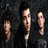 Pixelated static icon showing three vertical humanoid figures with light skin tones against a dark background, each in distinct poses and orientations.