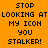 Orange background with black pixelated text reading STOP LOOKING AT MY ICON YOU STALKER! and cyan highlighted sections.