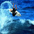 Animated surfing icon showing a person on a surfboard in two sequential frames with blue ocean background and white water spray.