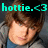 Pixelated image of a person with brown hair wearing a blue shirt and gray jacket, with cyan text overlay reading 'hottie.<3' at the top.