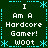 A 4-frame animated contact sheet showing a pixelated green background with cyan decorative borders and repeated white text "I Am A Hardcore Gamer! WOOT" arranged in four identical quadrants.