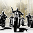 Pixelated black-and-white image of a stylized character with raised arm, standing among other figures against a light gradient background.