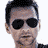Three side-by-side pixelated headshots of a man with dark hair and sunglasses, with text overlays reading "DAVE GAHAN" and "KINGDOM THE NEW SINGLE".