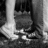 Black-and-white pixelated image of feet on grass with overlaid text reading "dont be afraid to say... I LOVE YOU <3".