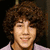 A person with curly brown hair wearing a light purple shirt appears in two side-by-side , one with 'nick jay' text above and the other with a solid purple background