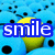 Blue background with scattered black dots, a yellow and green gradient shape behind blue text reading 'smile' in white lowercase letters.
