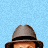 Pixelated contact sheet of four character faces from a movie-themed animated icon with pink text reading THE LOVE GURU on blue background.
