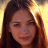 A 48x48 pixel buddy icon featuring a contact sheet of two animated frames showing a person with long brown hair against a bright background, alongside green text reading "OriginalIcons.com" on a dark green backdrop.