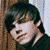 Six pixelated portraits of a young man with dark hair in various poses, alongside blue text reading 'click five' with star symbols on white background.