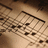 Pixelated image of sheet music with black musical notes on a beige staff, accompanied by pixelated text reading "You Are The Music In Me".