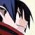 Pixelated close-up of a character's face with black hair, blue clothing, and red accents on the lower portion.