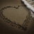 A heart-shaped icon with red text reading "I love you so much Jake" and a heart symbol, set against a dark background with a metallic object partially visible.