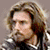 A 2x2 contact sheet of three animated frames from a buddy icon featuring a character with long hair and a beard in different poses against varying backgrounds.