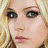 A pixelated image of a person with blonde hair, showing two distinct facial expressions across separate