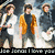 A pixelated group of four people on stage with guitars, one wearing a yellow jacket, under the text "I love you".