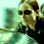 A pixelated contact sheet showing two frames of an animated icon featuring a character from The Matrix with green text reading "Original Icons .com" on the right side.