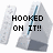 Pixelated image with gray and blue shapes and black text reading HOOKED ON IT!!