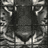 A static image with a red background, featuring black-and-white text and a grayscale animal face on the left.