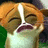 Pixelated close-up of a cartoon character with orange hair, closed eyes, and a wide open mouth showing teeth.