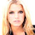 Static pixelated image of a person with long light brown hair and dark eyes against a bright background, appearing to be a low-resolution celebrity icon.