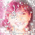 A pixelated image of a person with pink hair and light skin smiling, displayed in three overlapping views against a white background.