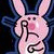 Animated pink bunny with blue outline holds finger to lips, text reads 'You Suck And That's Sad' on black and gray background.