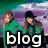 Two women in green tops stand against a purple and teal background with the word 'blog' visible.