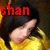Pixelated image showing a person with dark hair lying down, wearing yellow clothing, with red text 'shan' above the head.
