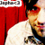 Pixelated image of a person in a red jacket and white shirt with a blurred background, featuring partial text at the top left.