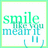 Pixelated green and blue text reads 'smile like you mean it' with a hand cursor icon below, all on a white background with light green border.