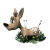 Animated cartoon deer with light brown fur and white spots stands on green grass, turning its head through multiple poses.