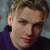 A split-frame contact sheet showing a pixelated portrait of Nick Carter on the left and green text reading "Original Icons .com" on the right against a dark background.