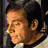 A pixelated buddy icon featuring a side-profile of a man with dark hair and an orange background displaying the text "The 40 Year-Old Virgin" in white block letters.