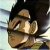 Pixelated close-up of a character with dark hair and light skin, showing a hand near the face against a blurred background.