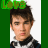 A 48x48 pixel buddy icon featuring a male character with brown hair and a checkered shirt, displayed in two frames showing text animation above his head against a green background.