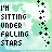 Pixelated text reads "I'M SITTING UNDER FALLING STARS" with scattered plus signs on a light green and white background.