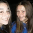 Two pixelated human faces side-by-side against a dark background, one with light skin and short hair in blue clothing, the other with light skin and long brown hair in blue clothing.