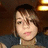 A pixelated image of a person with brown hair and dark clothing, featuring blue text reading "HeBaT." on the right side.