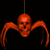 A pixelated red-orange skull with elongated limbs hangs from a thin vertical line against a black background.