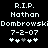 Pixelated text memorializing Nathan Dombrowski with date 7-2-07 and four stars, two white and two grayed-out on black background.