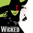 Animated pixel art of a green-skinned witch with black hair and pointed hat, wearing dark clothing, holding a white object while text changes from 'I' to 'Love'.