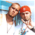 Pixelated static image of two people in a close pose against a light blue background with white and brown elements.